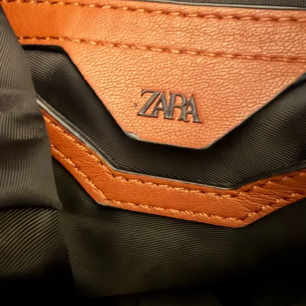 Zara faux leather handbag, adjustable straps, and very roomy.